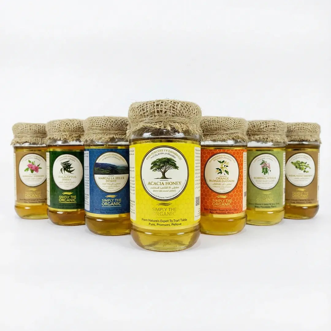 Organic Honey Collection – Pure Natural Honey Products row of honey jars with various labels on a white background